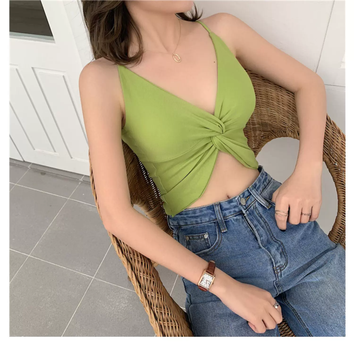 Seated view showing curved hem and V-neck of green padded bralette