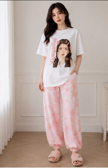 Front view of women's cotton graphic T-shirt and pink check pyjama set