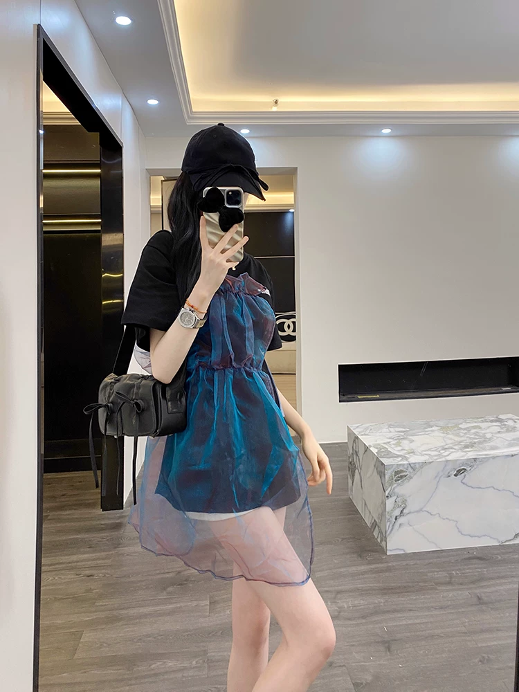 Front view of black oversized T-shirt with blue sheer overlay