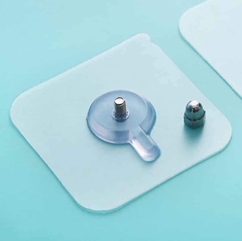 Side view of adhesive screw clip on clear acrylic pad